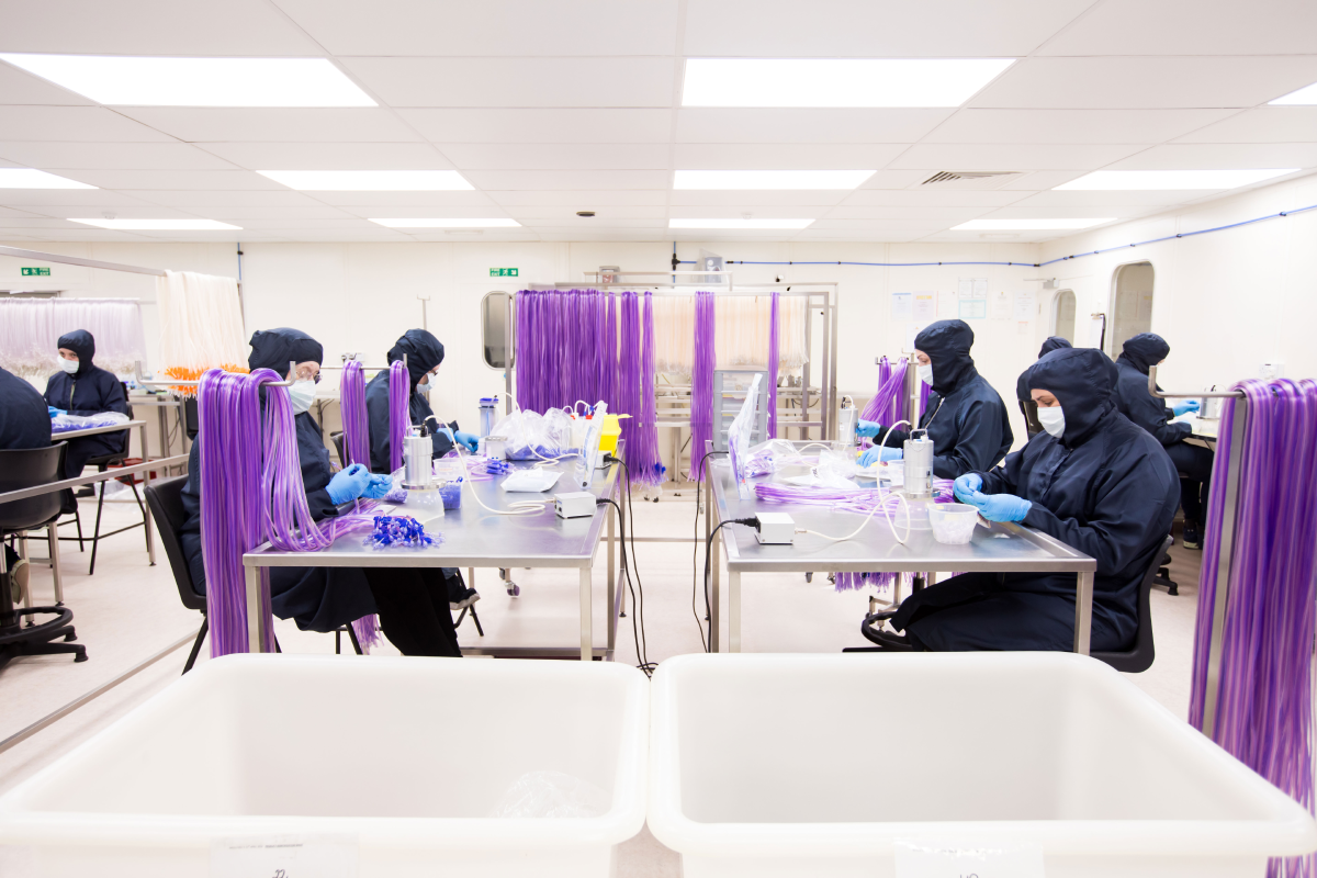 Technicians assembling single-use anaesthesia and infusion devices in an ISO Class 7 cleanroom at Meridian Medical, using validated processes under ISO 13485-certified manufacturing controls