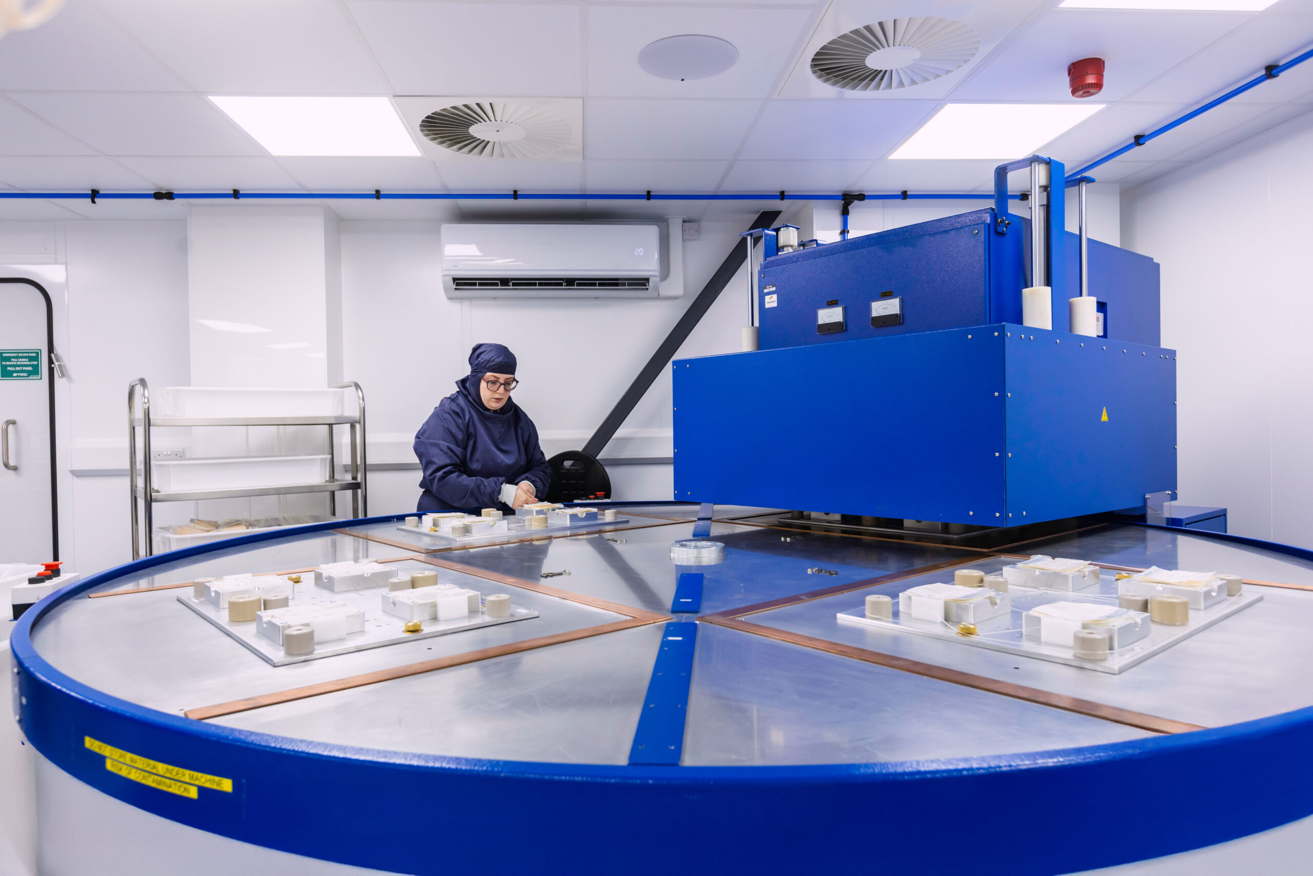 Cleanroom technician operating a rotary RF welding machine for the production of wound care and surgical devices at Meridian Medical